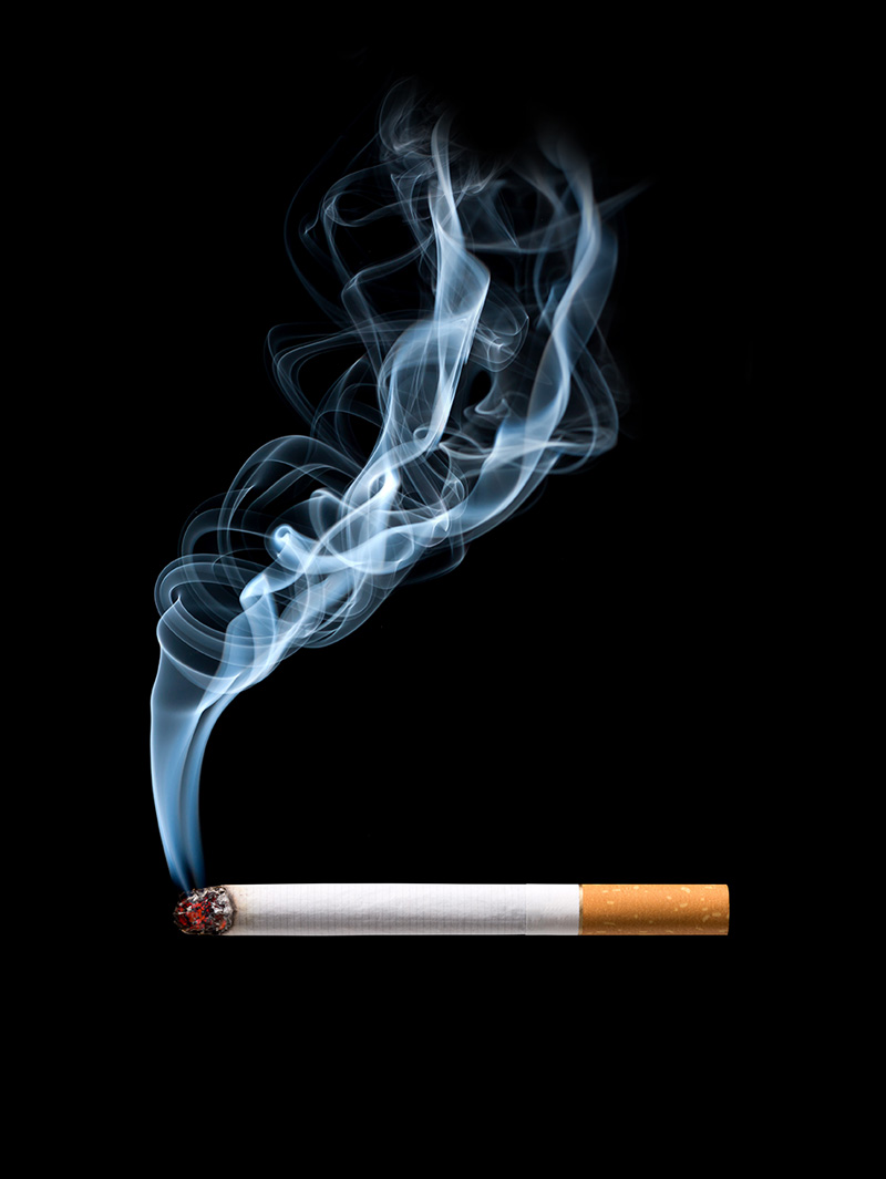Lit cigarette with smoke